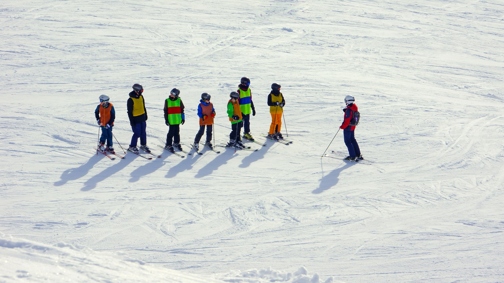 Skiers are standing in the snow.